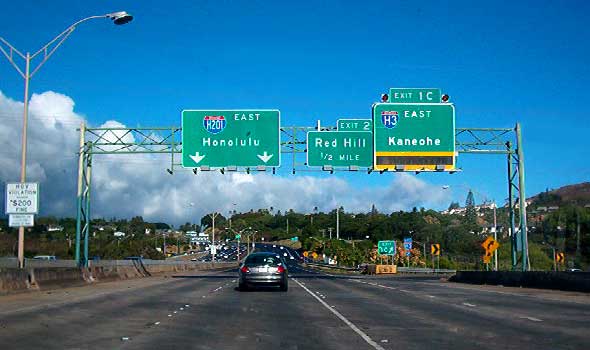 Overhead signs above Moanalua Freeway, eastbound at Interstate H-3 exit, including new Interstate H-201 sign