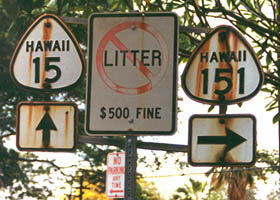 Rust-stained cutout shields at former route 15/route 151 junction on Big Island