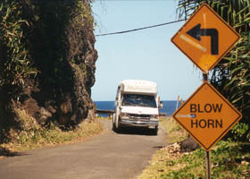 Bus in middle of blind curve; "Blow Horn" sign