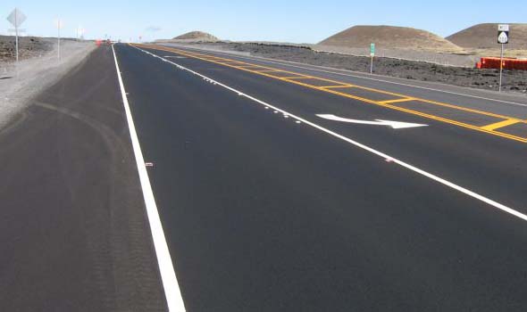 Smooth pavement on the new Ala Mauna Saddle Road alignment, westbound at the left turn lane just west of the Mauna Kea summit road turnoff