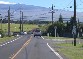 Wide view of south end of Kohala Mountain Road (state route 250), at junction with Kawaihae Road (state route 19) west of Waimea